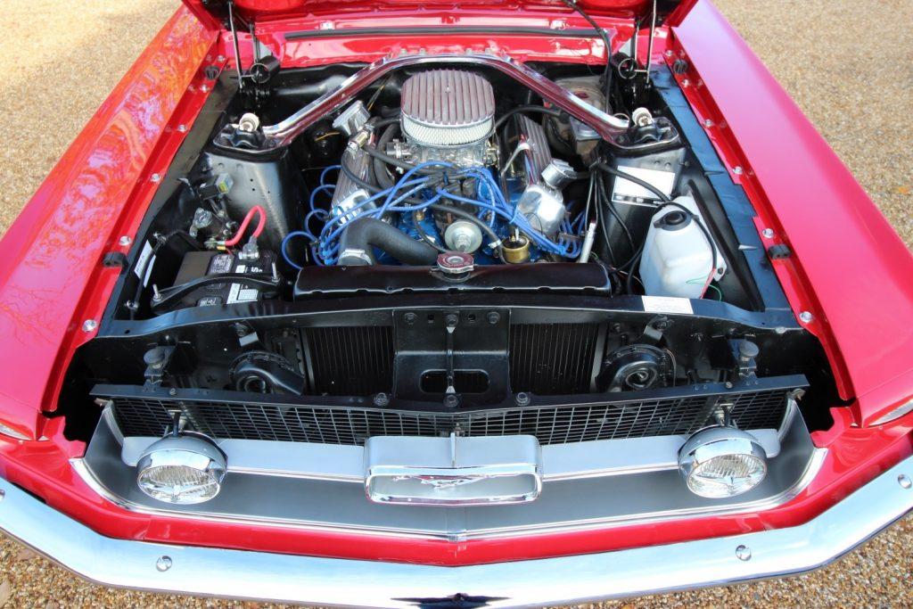 Caption: 1967 Classic Ford Mustang 289 Coupe Manual, in Candy Apple Red.