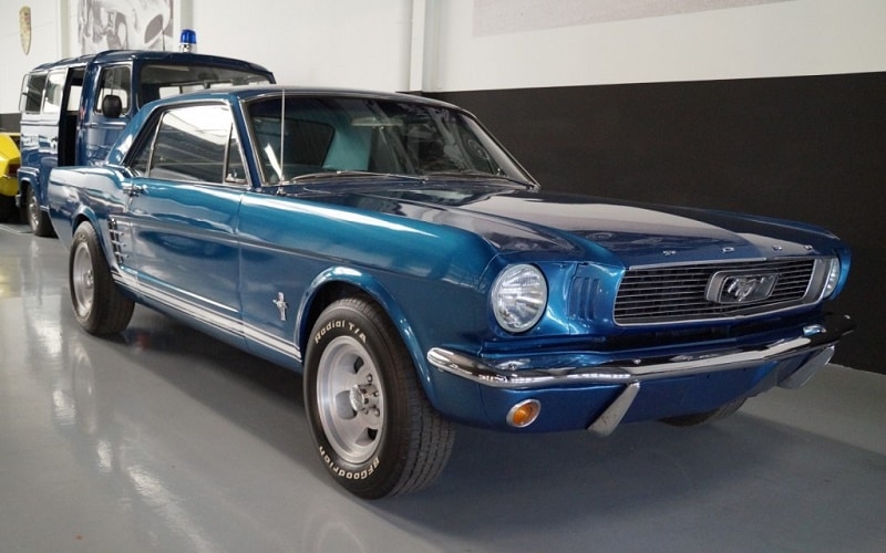 Navy blue Metallic 1965 Ford Mustang Coupe in a car gallery